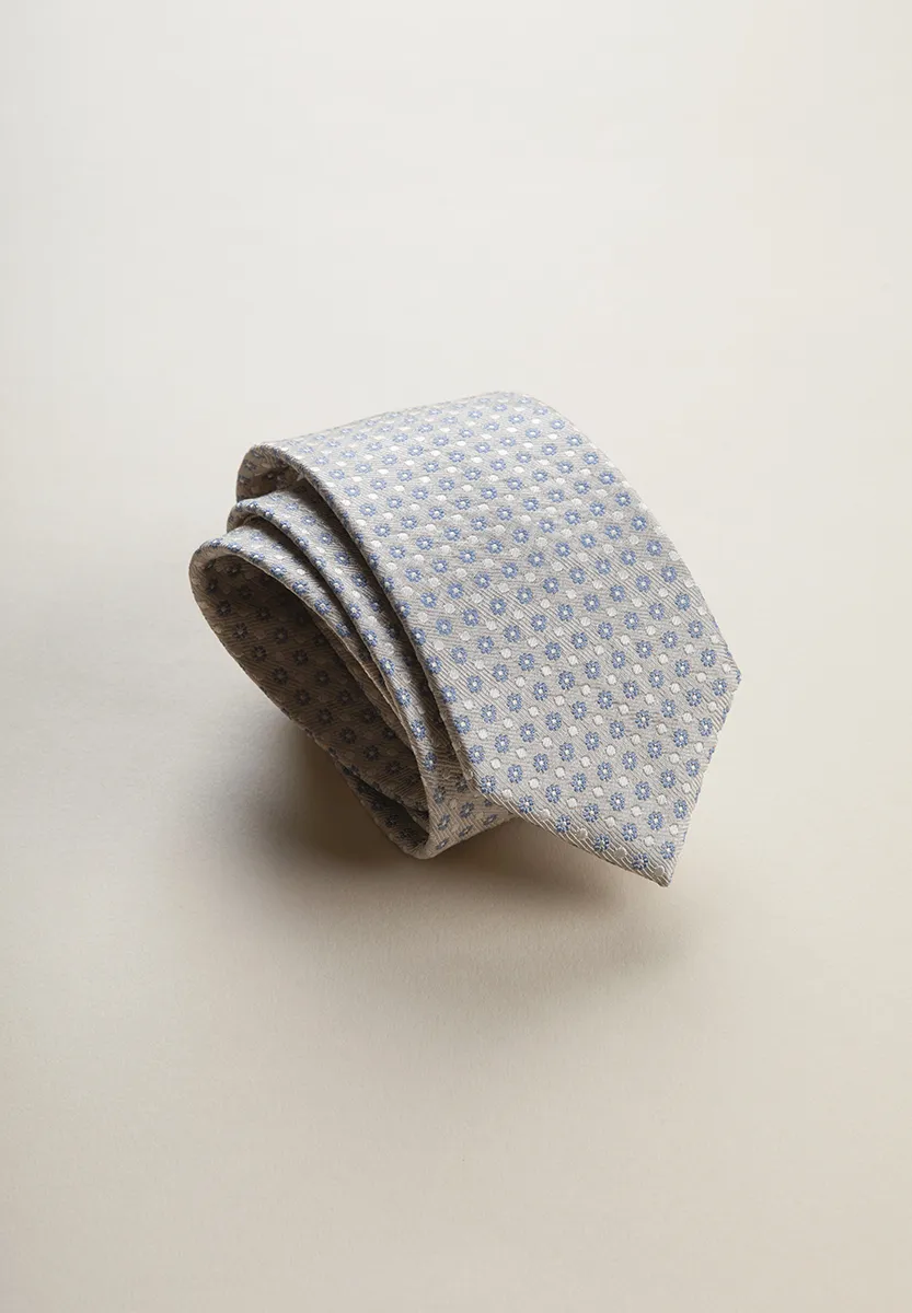 Cravatta beige fiorata azzurra seta